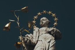 a statue of a person holding a star
